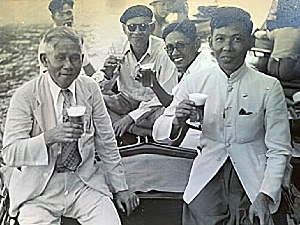 Praya Bhirom Bhakdi with his son, Vidya, and some guests